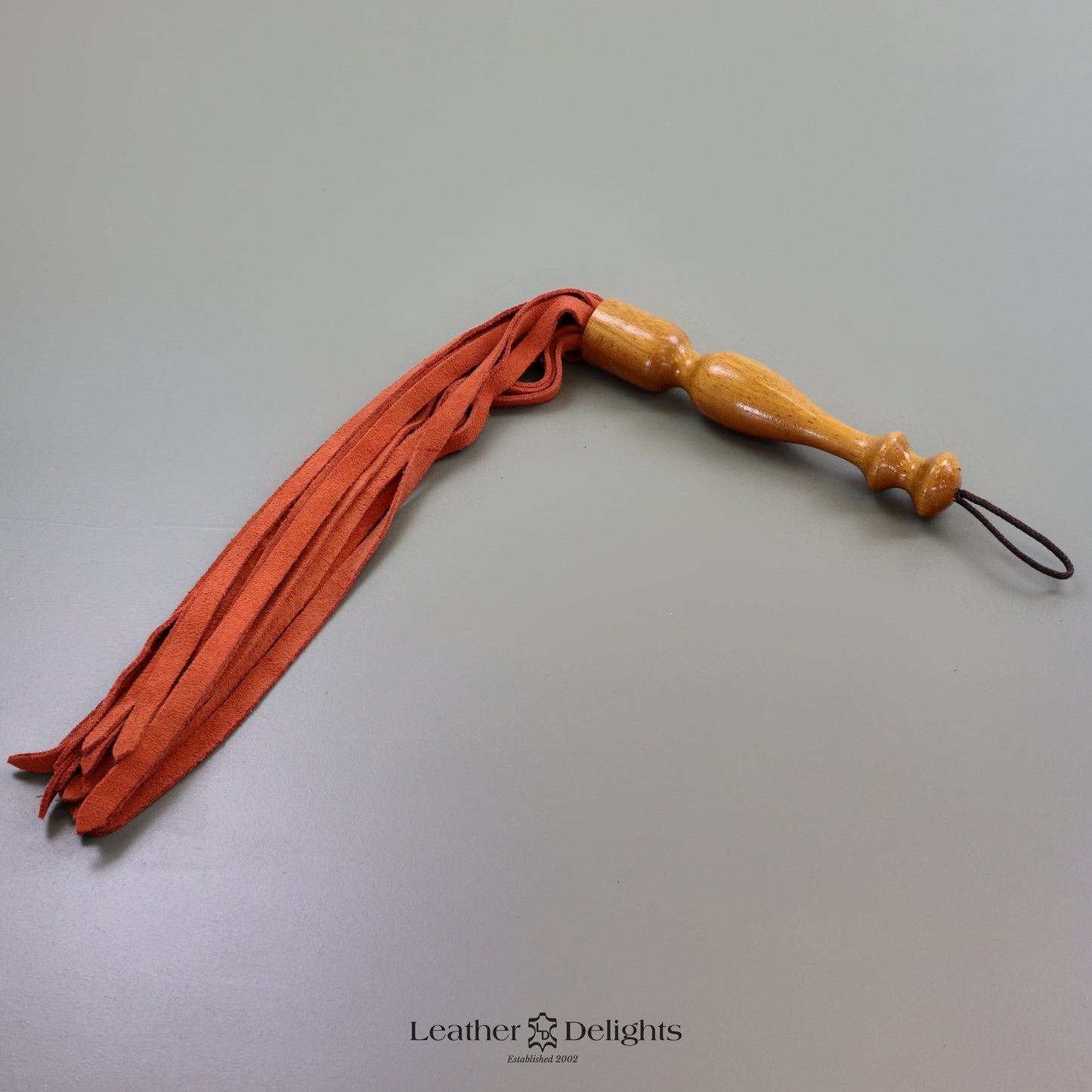 Flogger en daim orange coucher de soleil