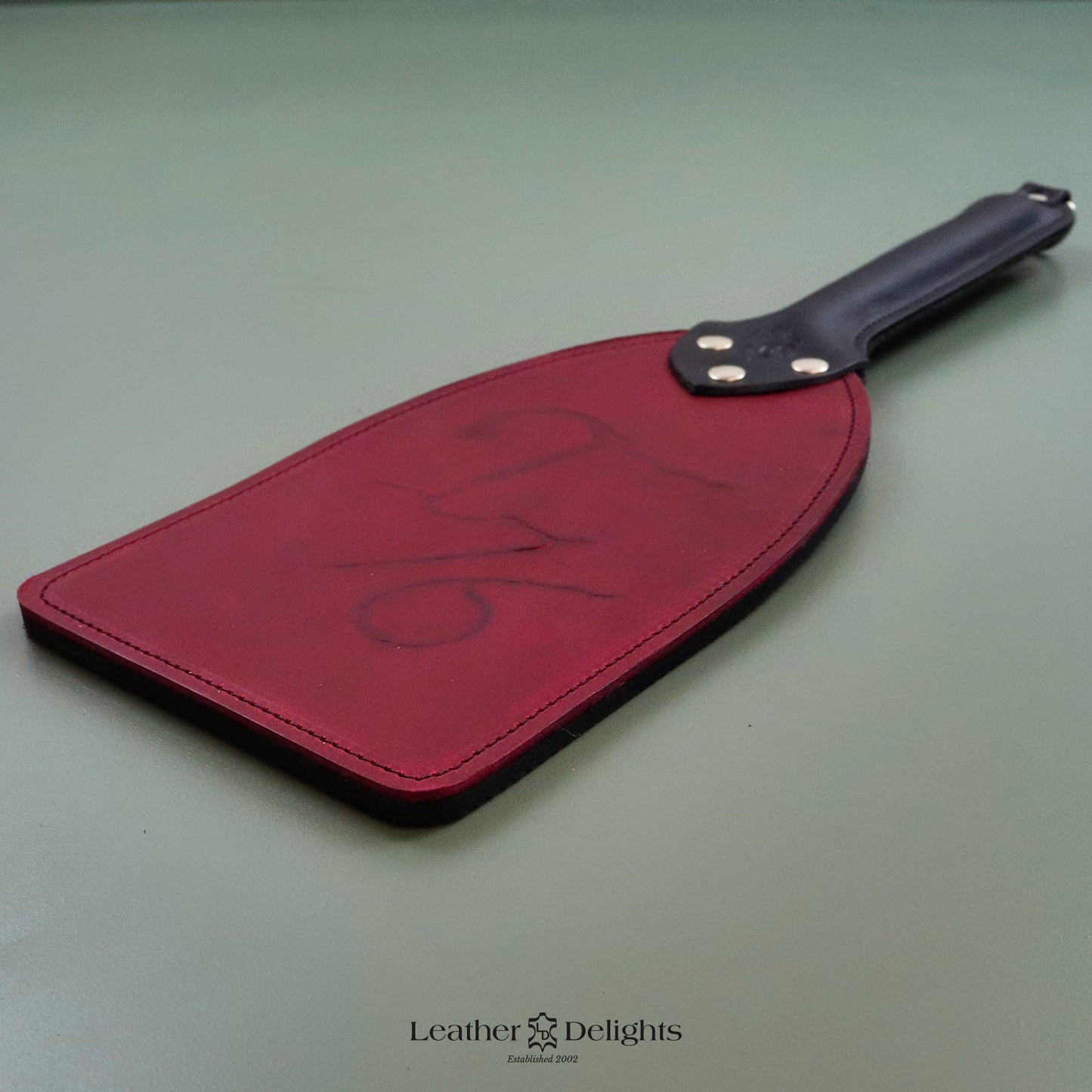 Booty Beater - Branded Red Pull Up Leather & Dimpled Rubber