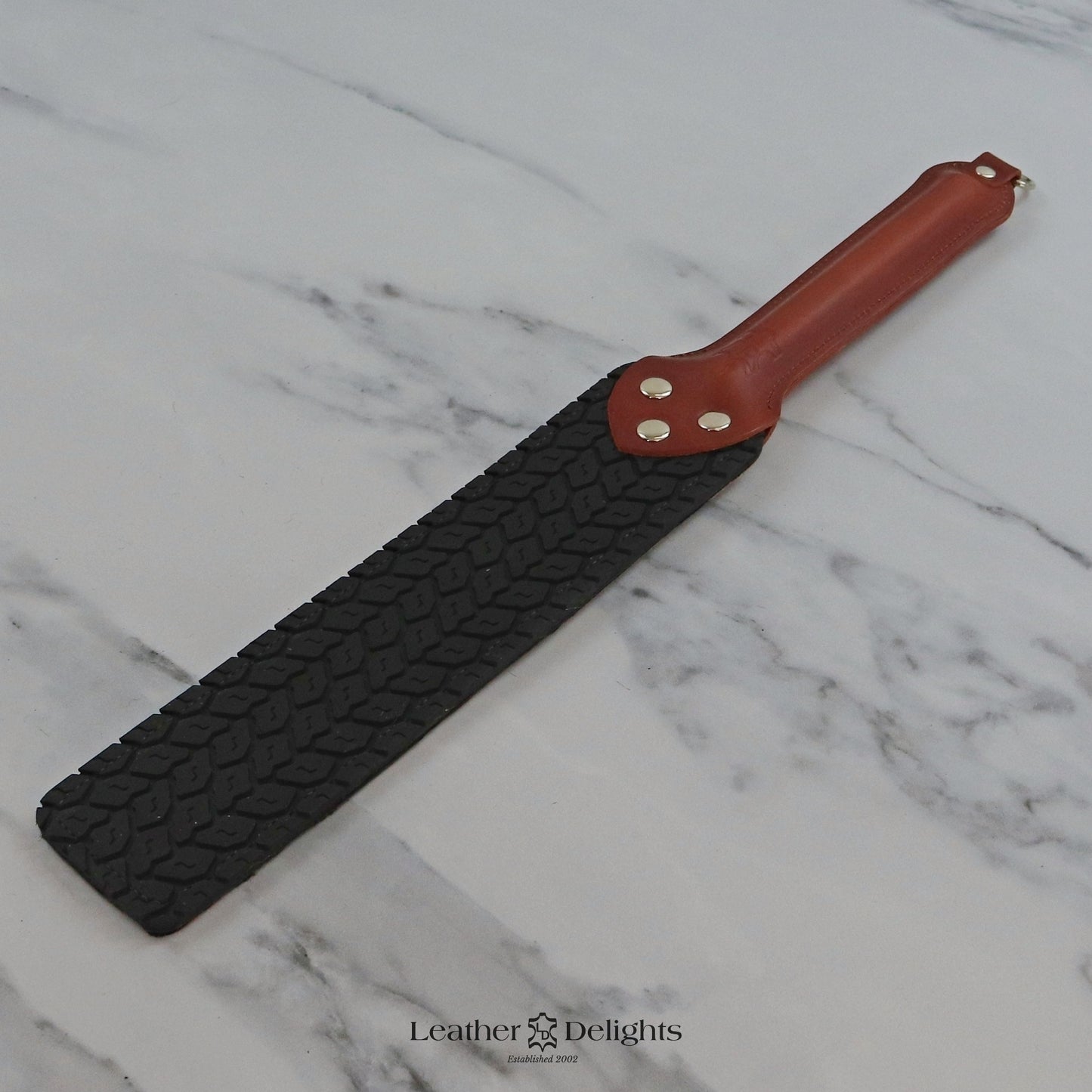 Punishment Paddle - Animal Print Sheepskin & Black Tyre Tread Rubber