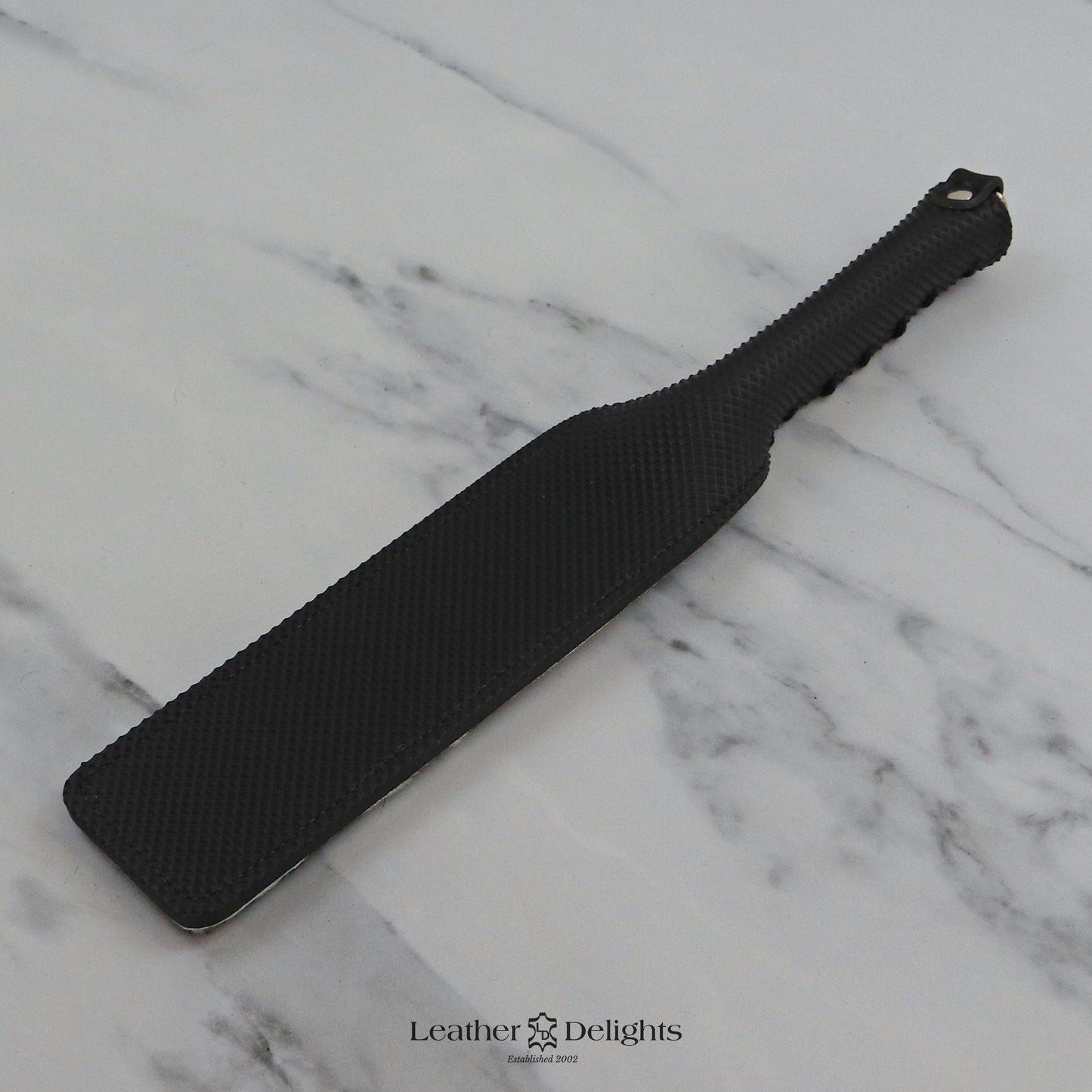 Double Cheek Slapper - Animal Print Sheepskin & Black Dimpled Rubber