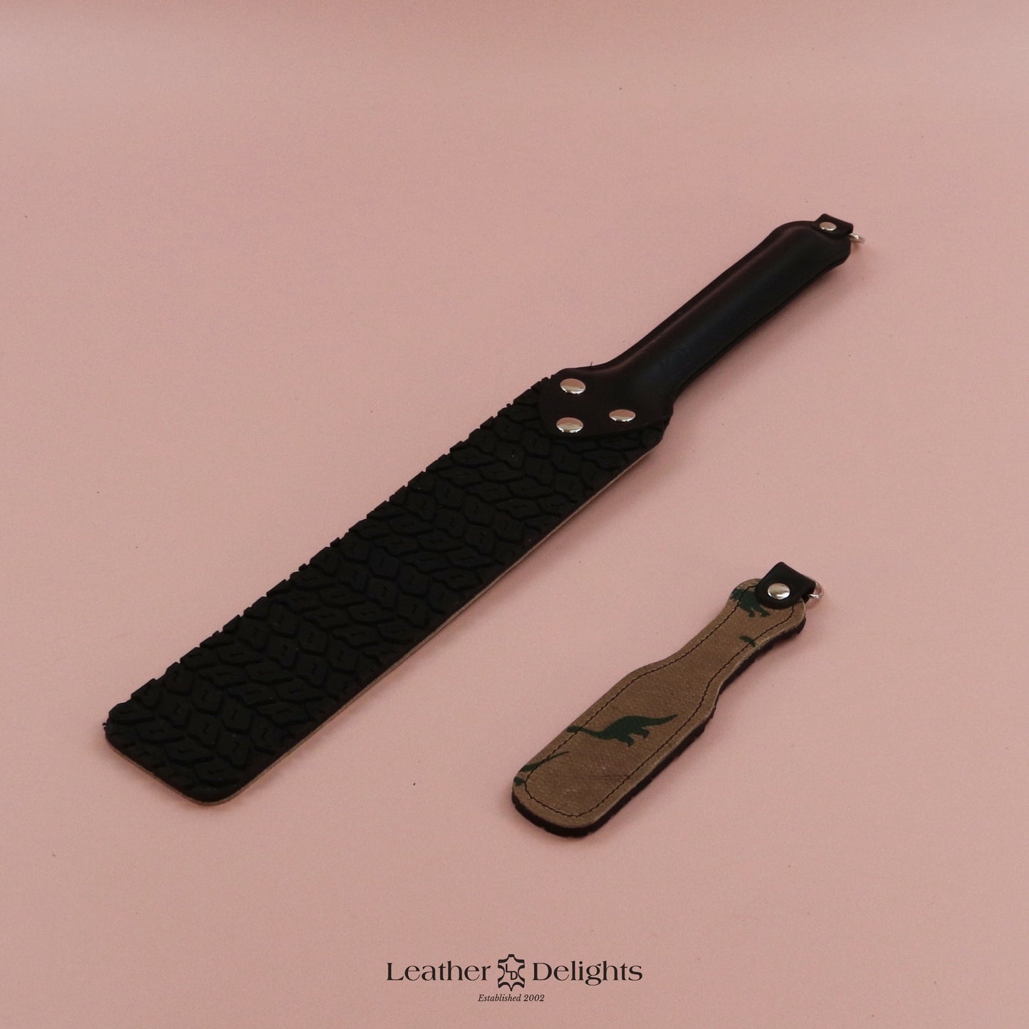 Punishment Paddle - Dinosaur Print Leather with Black Tyre Tread Rubber