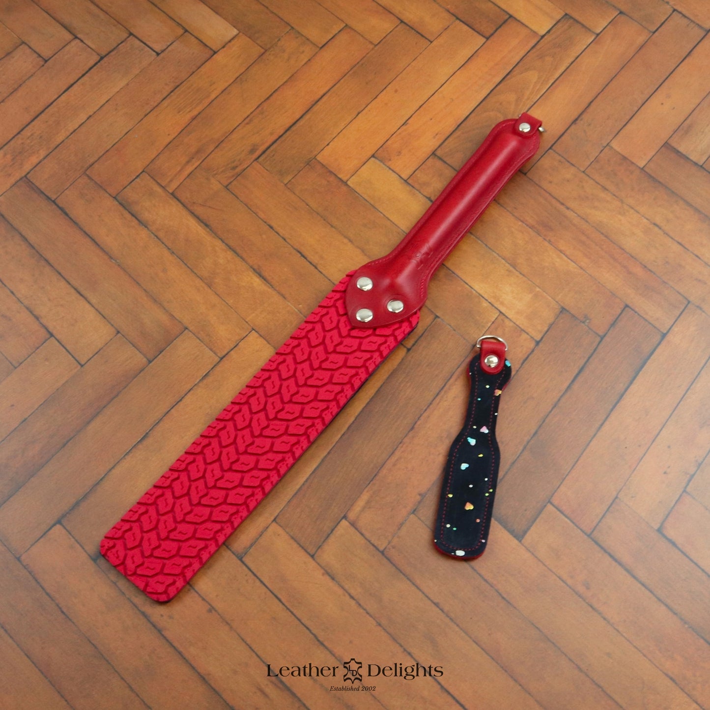 Punishment Paddle - Sparkly Hearts & Red Tyre Tread Rubber with a Red Handle