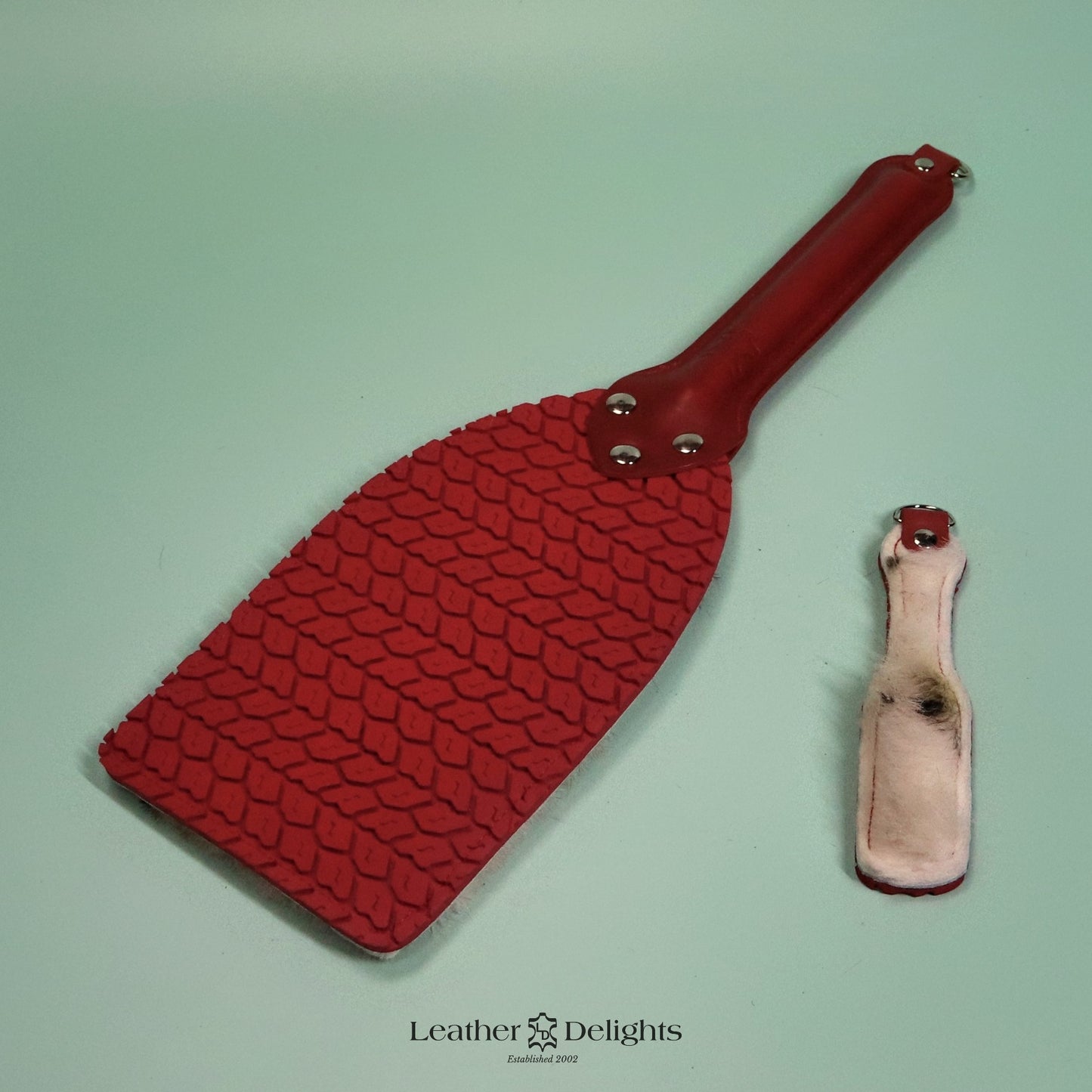 Booty Beater - Cream Sheepskin with Black Spots & Red Tyre Tread Rubber