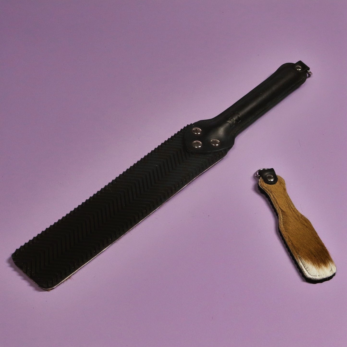 Punishment Paddle - Black Ripple Rubber & Springbok