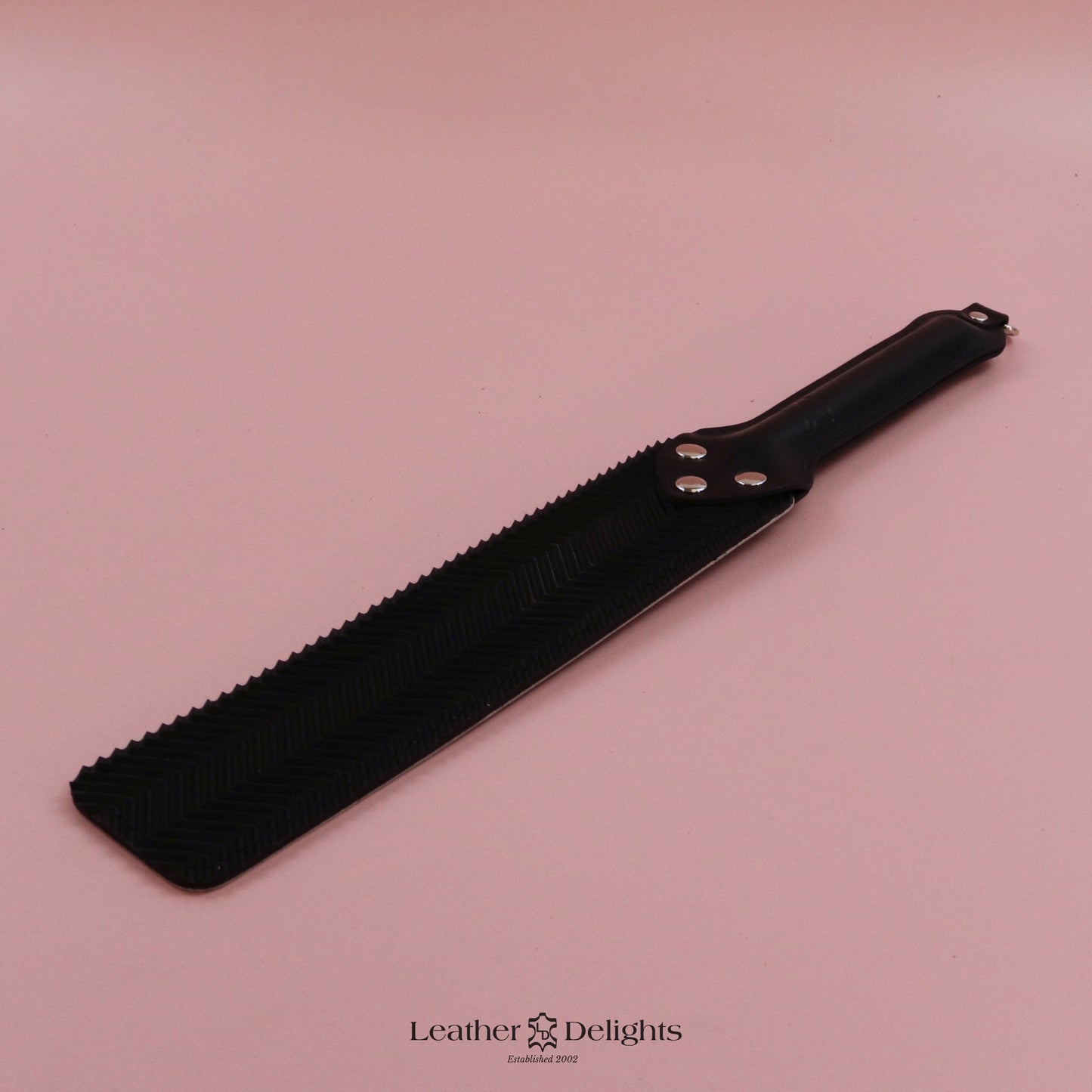 Punishment Paddle - Bones Leather & Black Ripple Rubber