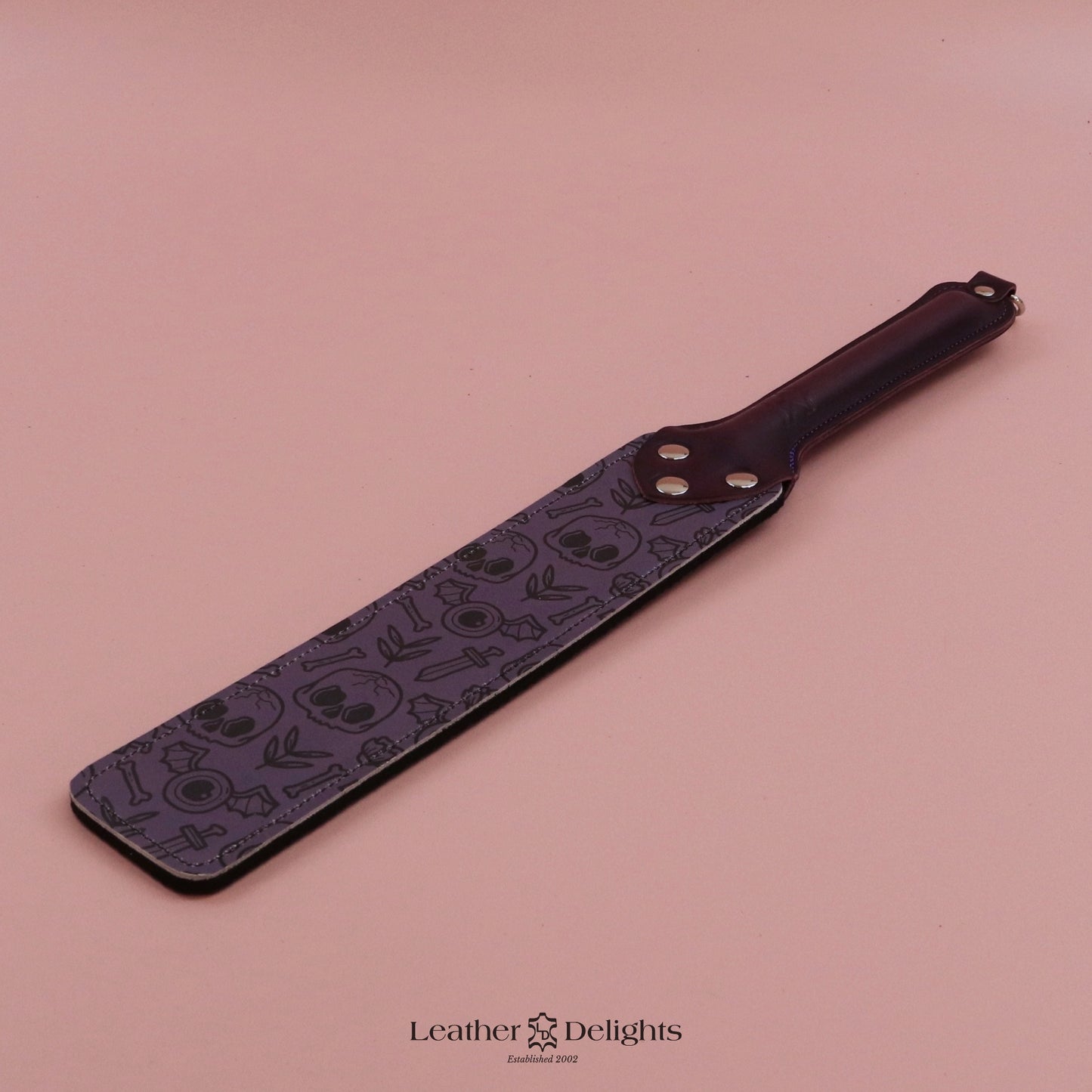 Punishment Paddle - Bones Leather & Black Dimpled Rubber with Purple Handle