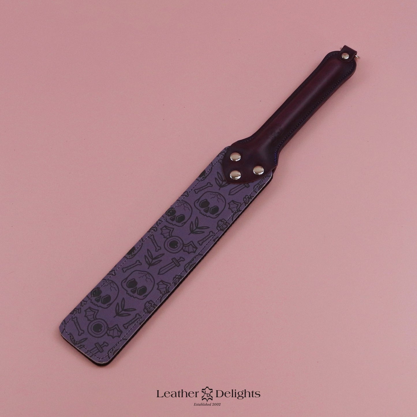 Punishment Paddle - Bones Leather & Black Dimpled Rubber with Purple Handle