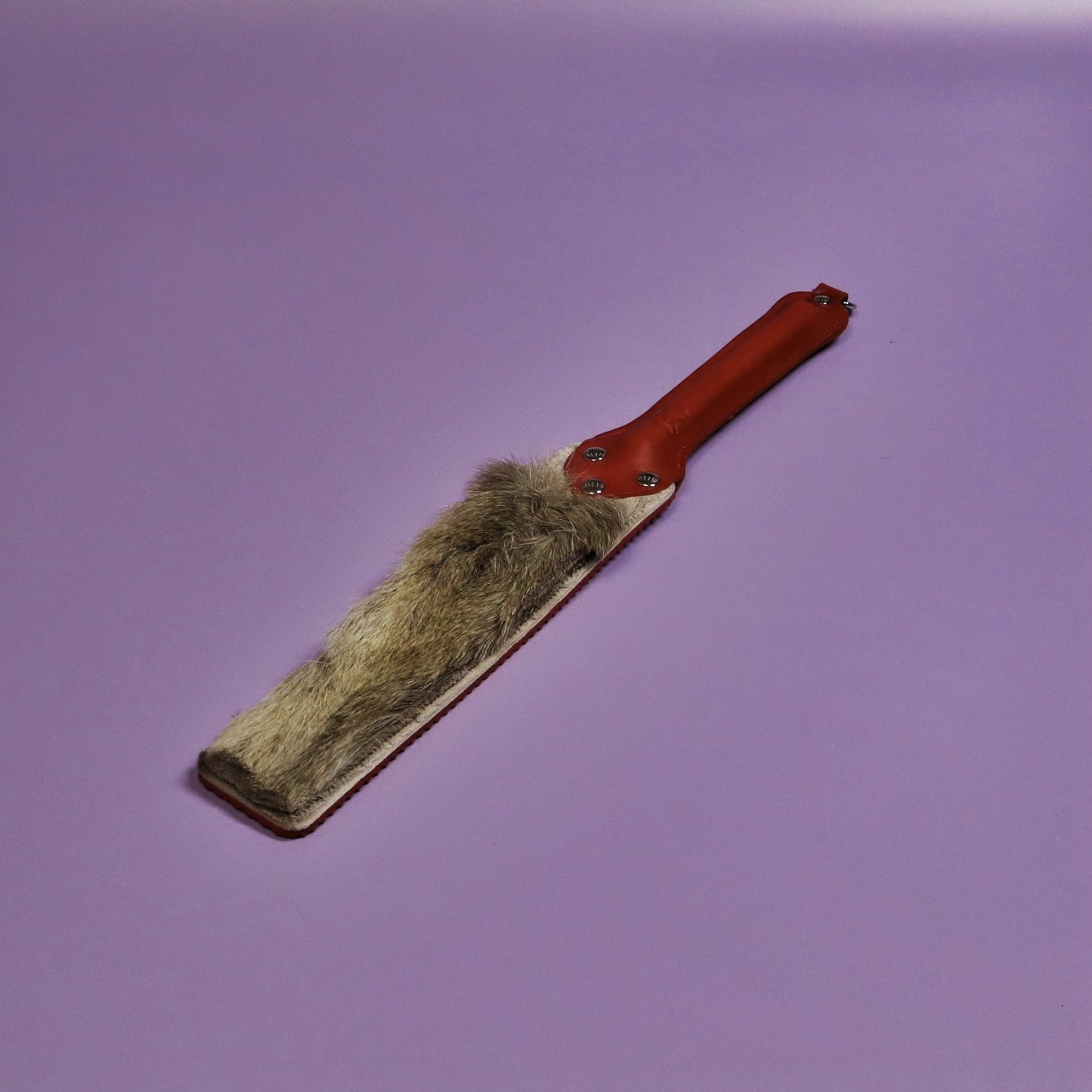 Punishment Paddle - Red Ripple Rubber & Hair on Hide Reindeer with Red Handle