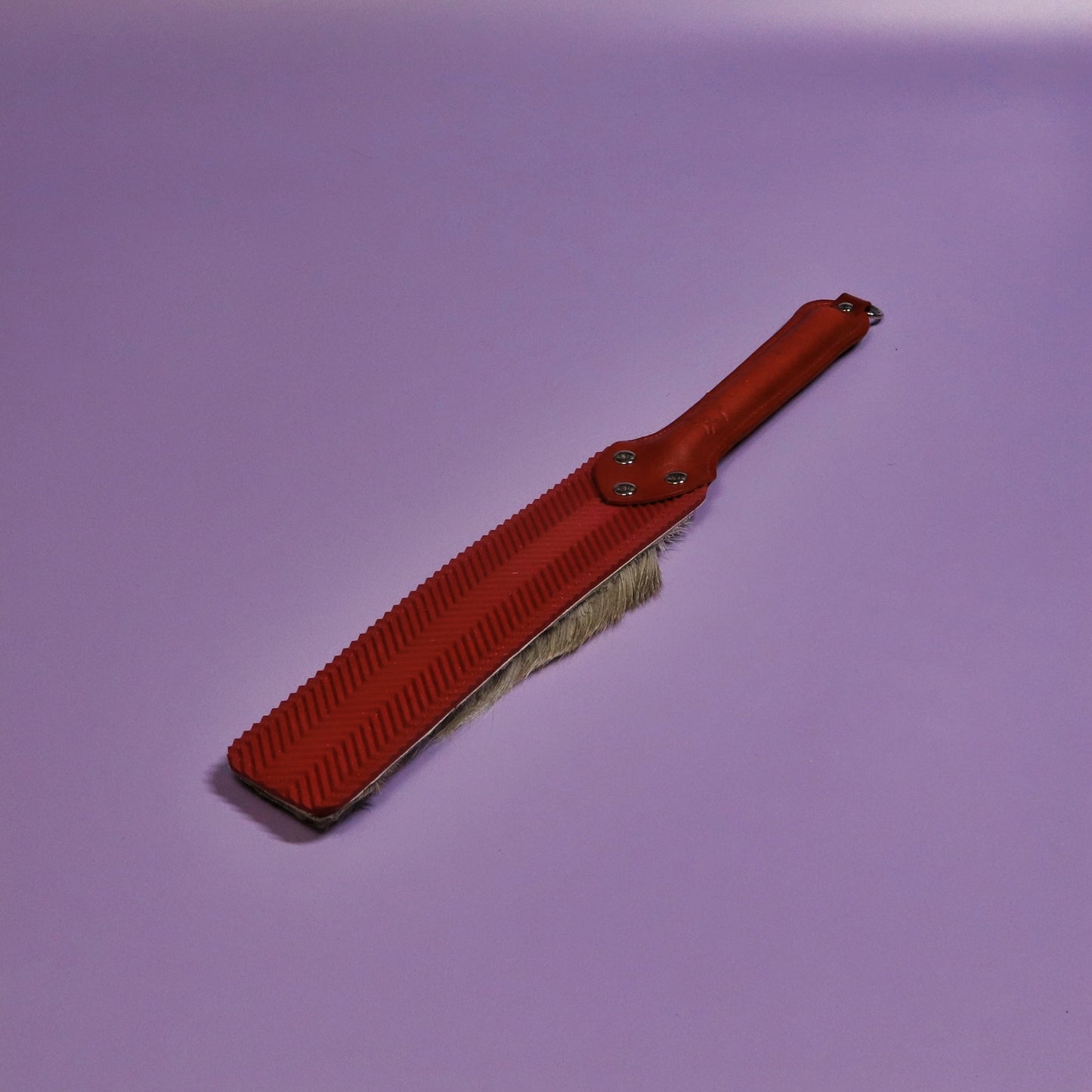 Punishment Paddle - Red Ripple Rubber & Hair on Hide Reindeer with Red Handle